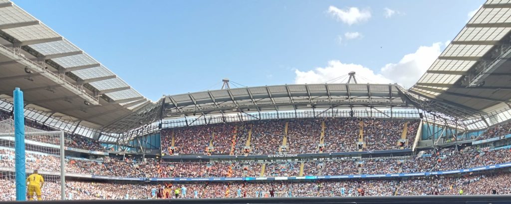 A view of the game from the Family Stand at the Etihad, captured by the post author with the advertising hoarding cropped out.